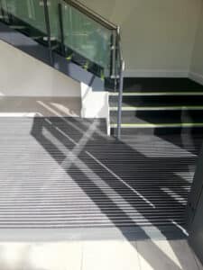 Facility Flooring experts installing TGD M-compliant stair nosings