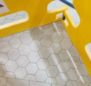 Facility Flooring team performing expert tiling maintenance at Leprino Foods production facility