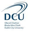 dcu_logo_stacked_yellow_slate_transparent